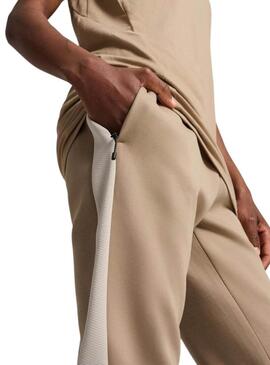 Pantaloni Puma Evostripe beige per uomo.