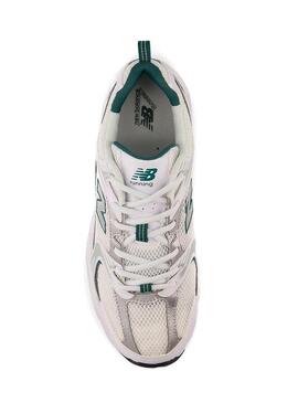 Sneakers New Balance 530 bianche con verde e argento per donna.