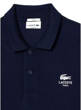 Polo Lacoste L.12.12 con logo stampato blu navy per uomo e donna